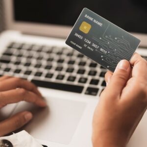 A person using a credit card to pay online
